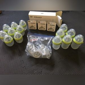 Huge lot of Como Tomo bottles and nipples